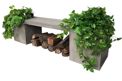 One of our planter boxes, filled with plants, resting on wood logs, set against a plain white background.