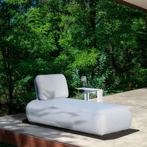 Outdoor furniture: A white aluminium outdoor lounge chair from the Iowa sofa collection on a wooden platform.
