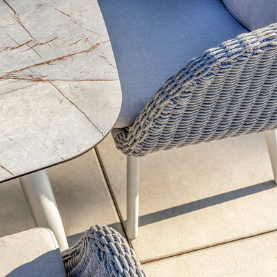 Close-up of the Sorrento Dining Chair by Couture Jardin, showcasing the intricate craftsmanship of the woven Olaphen rope in a soft, textured pattern. The durable and stylish rope design enhances the chair's aesthetic and functionality, ideal for outdoor use.