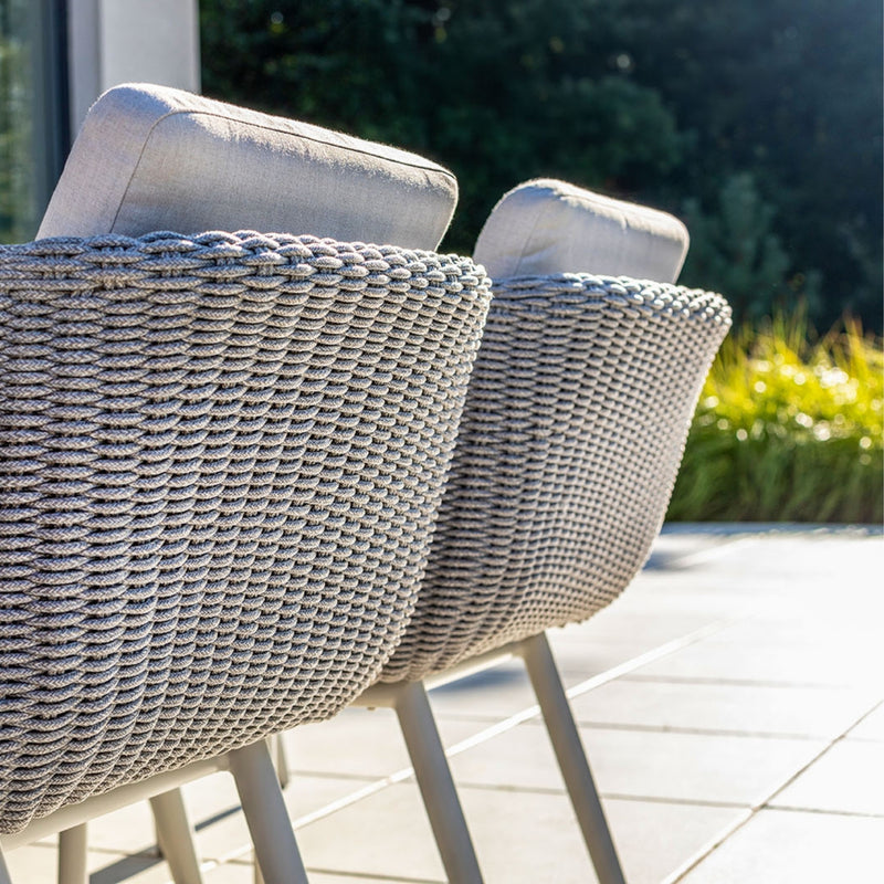 Close-up of the Sorrento Dining Chair by Couture Jardin, showcasing the intricate craftsmanship of the woven Olaphen rope in a soft, textured pattern. The durable and stylish rope design enhances the chair&