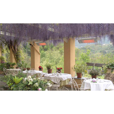 White Heatscope heaters installed in an outdoor eating area, surrounded by greenery and mountains in the background, enhancing outdoor living comfort.