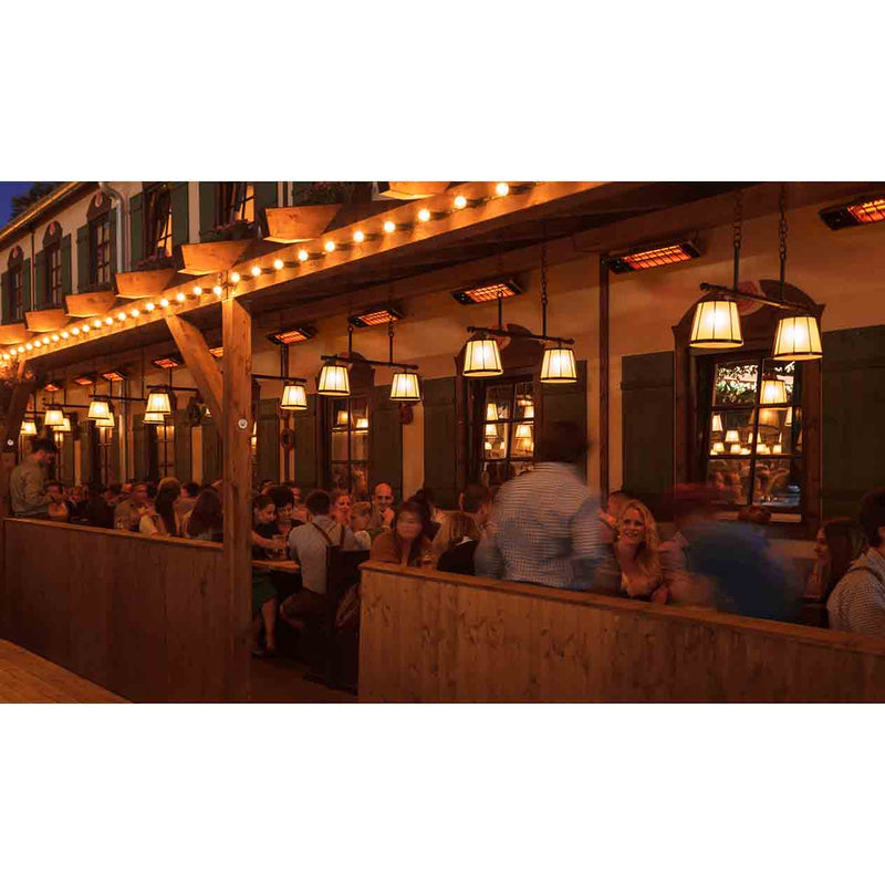 A cozy restaurant at night filled with black Heatscope heaters, offering warmth and creating a vibrant atmosphere for outdoor dining and socializing.